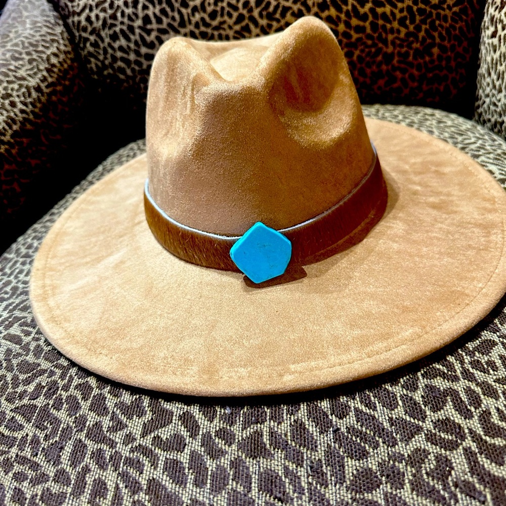 Tan suede cowboy hat with cowhide band with turquoise, adjustable size.